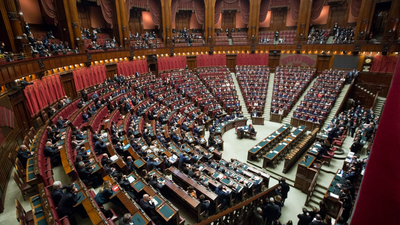 Image Credit: bird's-eye view of sitting on bench while discussion — Marco Oriolesi