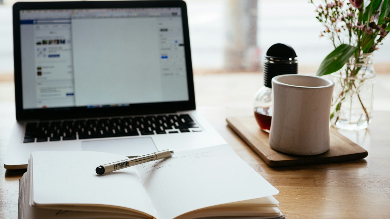 Image Credit: MacBook Pro near white open book — Nick Morrison
