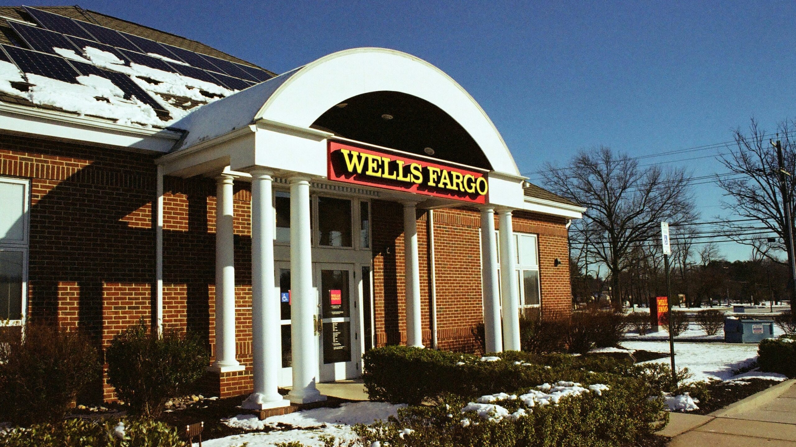 a store front with snow on the ground