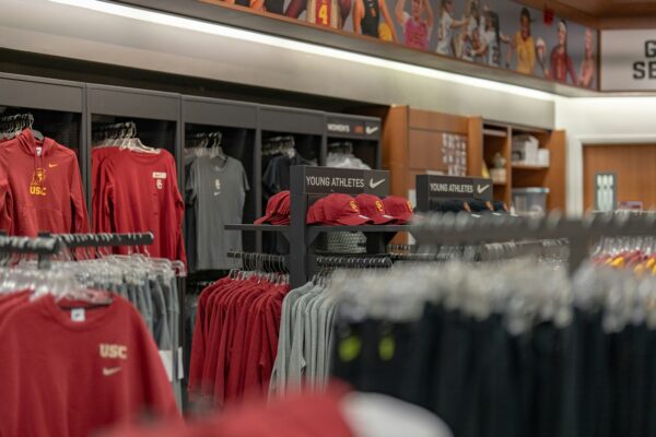 a store filled with lots of red and black shirts
