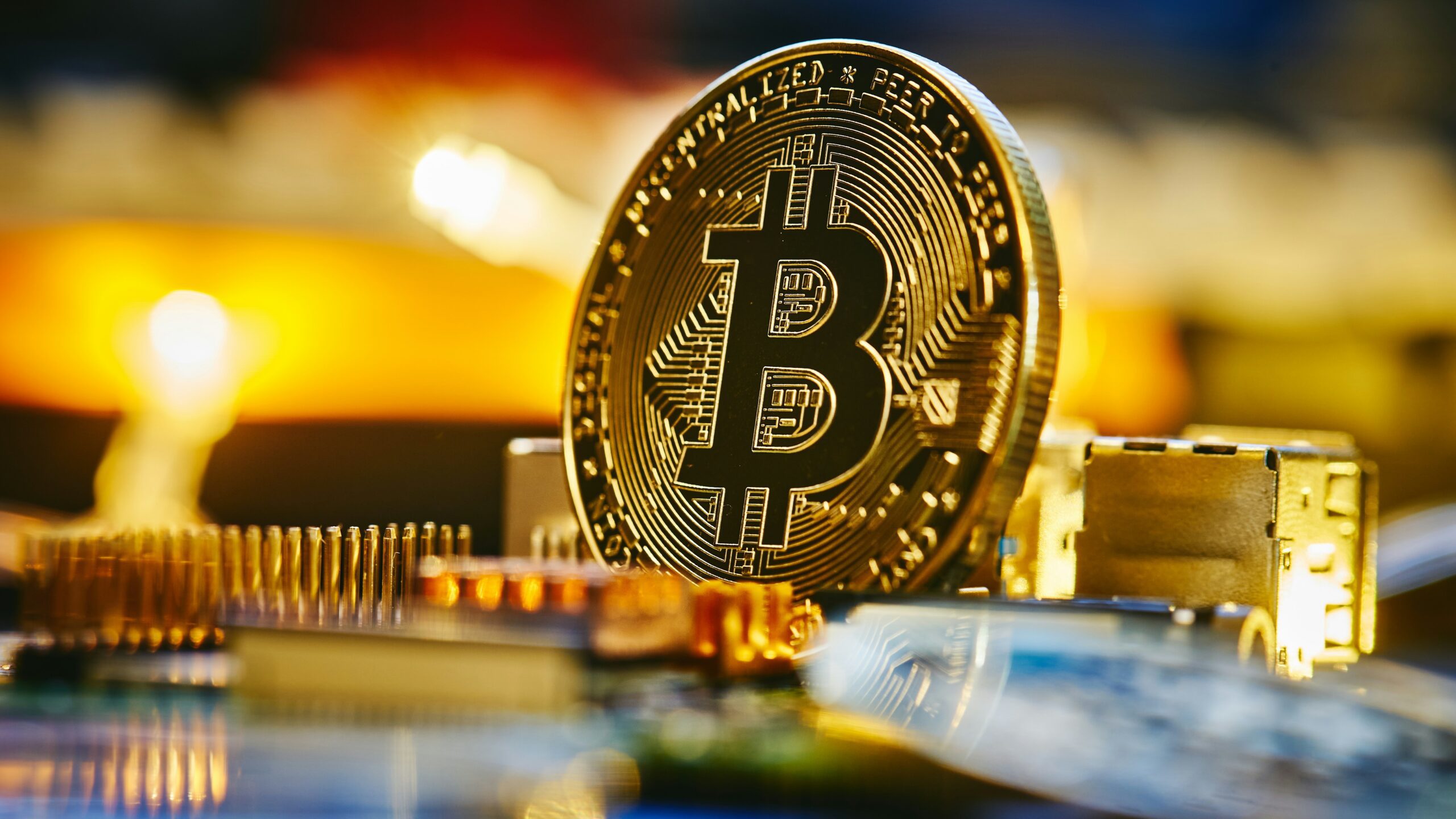 a bitcoin sitting on top of a computer chip