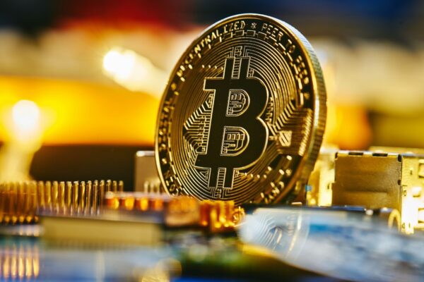 a bitcoin sitting on top of a computer chip