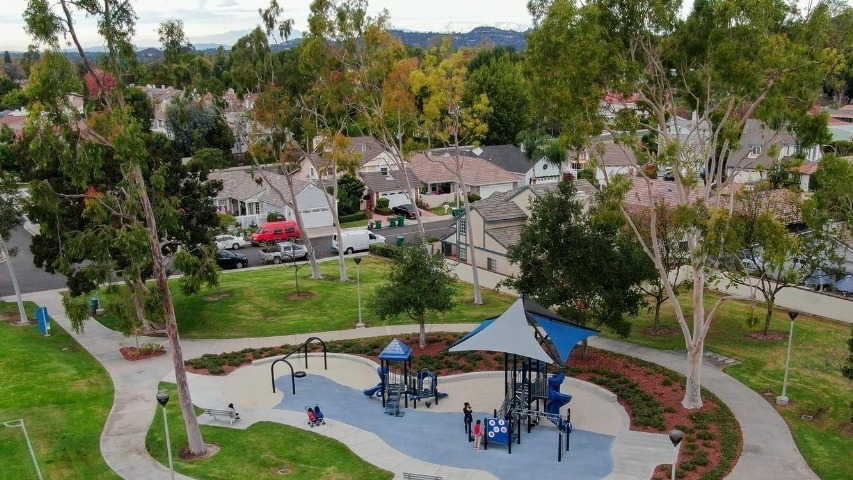 Suburban packed homes neighborhood with small park Vast subdivision in Irvine California USA