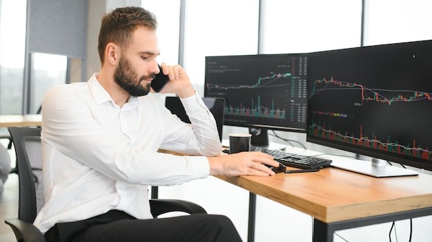 Financial Analysts and Day Traders Working on a Computers with MultiMonitor Workstations with RealTime Stocks Commodities and Exchange Market Charts