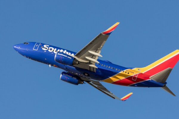 blue and red airplane on midair