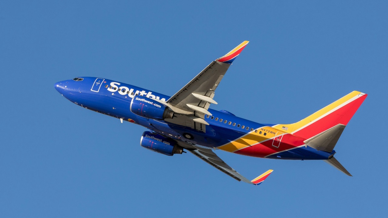blue and red airplane on midair