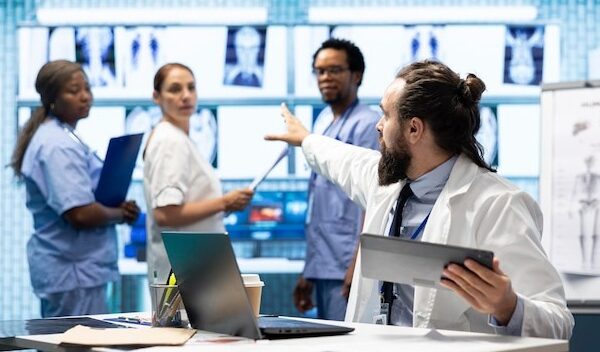 Healthcare experts in a strategic meeting discussing treatment protocols
