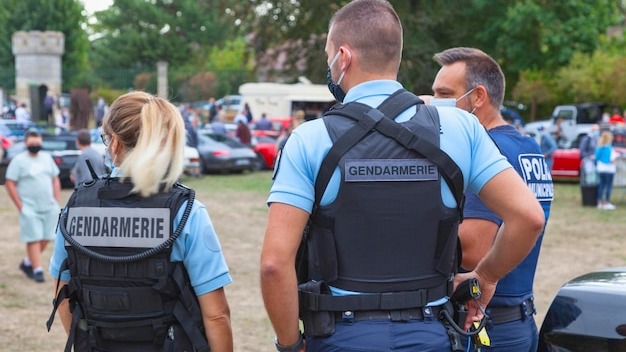 Two gendarmes and a municipal police officer