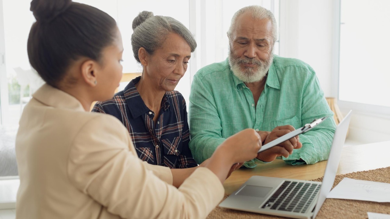 Financial adviser discussing information with a couple