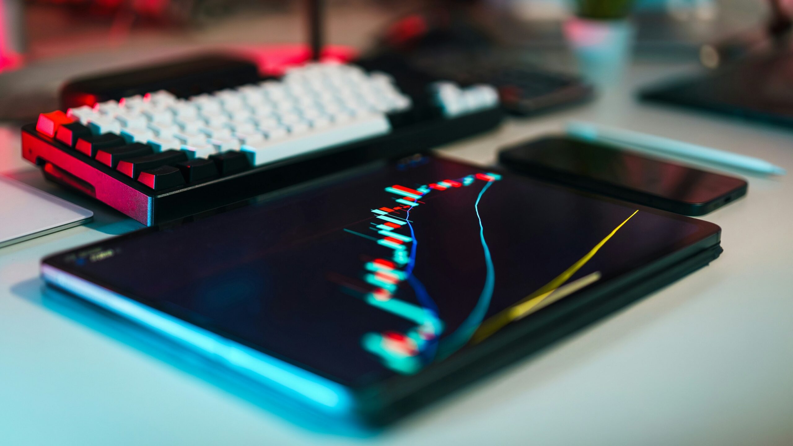 A computer keyboard sitting on top of a desk