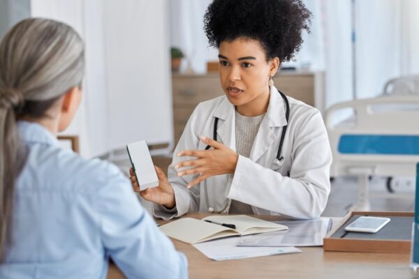 Health consultation with doctor and patient hospital and medicine prescription healthcare and help at medical office Women communication and advice health insurance and health care talk
