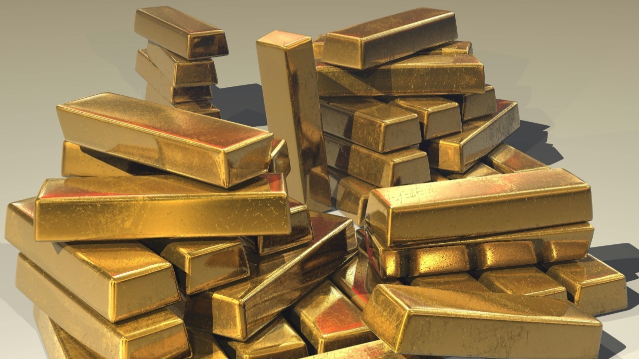 A pile of lustrous gold bars symbolizing wealth and prosperity.