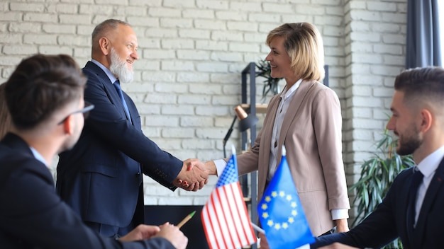 Diversity people talk the international conference partnership. Business people shaking hands, finishing up a meeting.