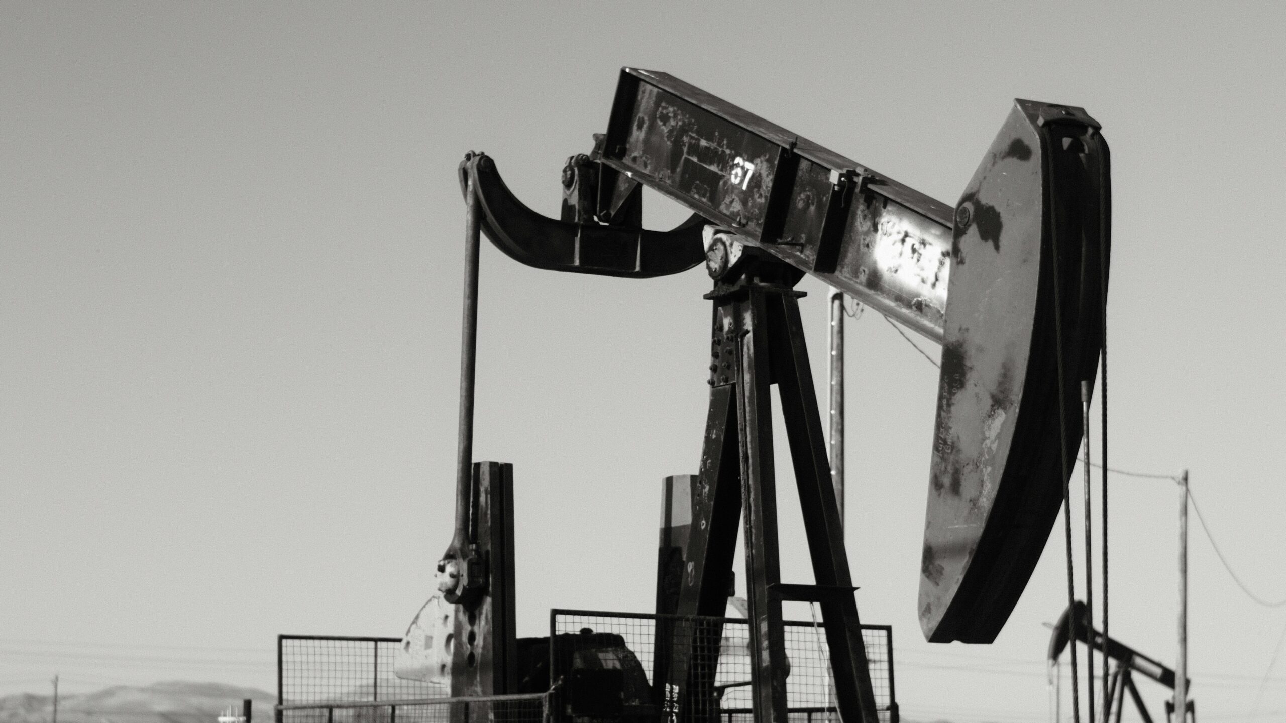 a black and white photo of an oil pump