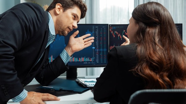 Two business traders discussing business statistic on report paper postulate