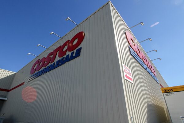 a large white building with a red and blue sign on it