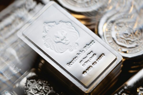 a pile of silver ingles sitting on top of each other