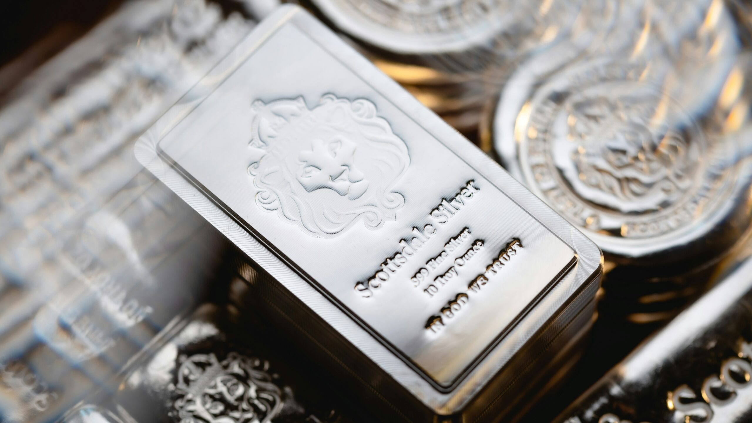 a pile of silver ingles sitting on top of each other