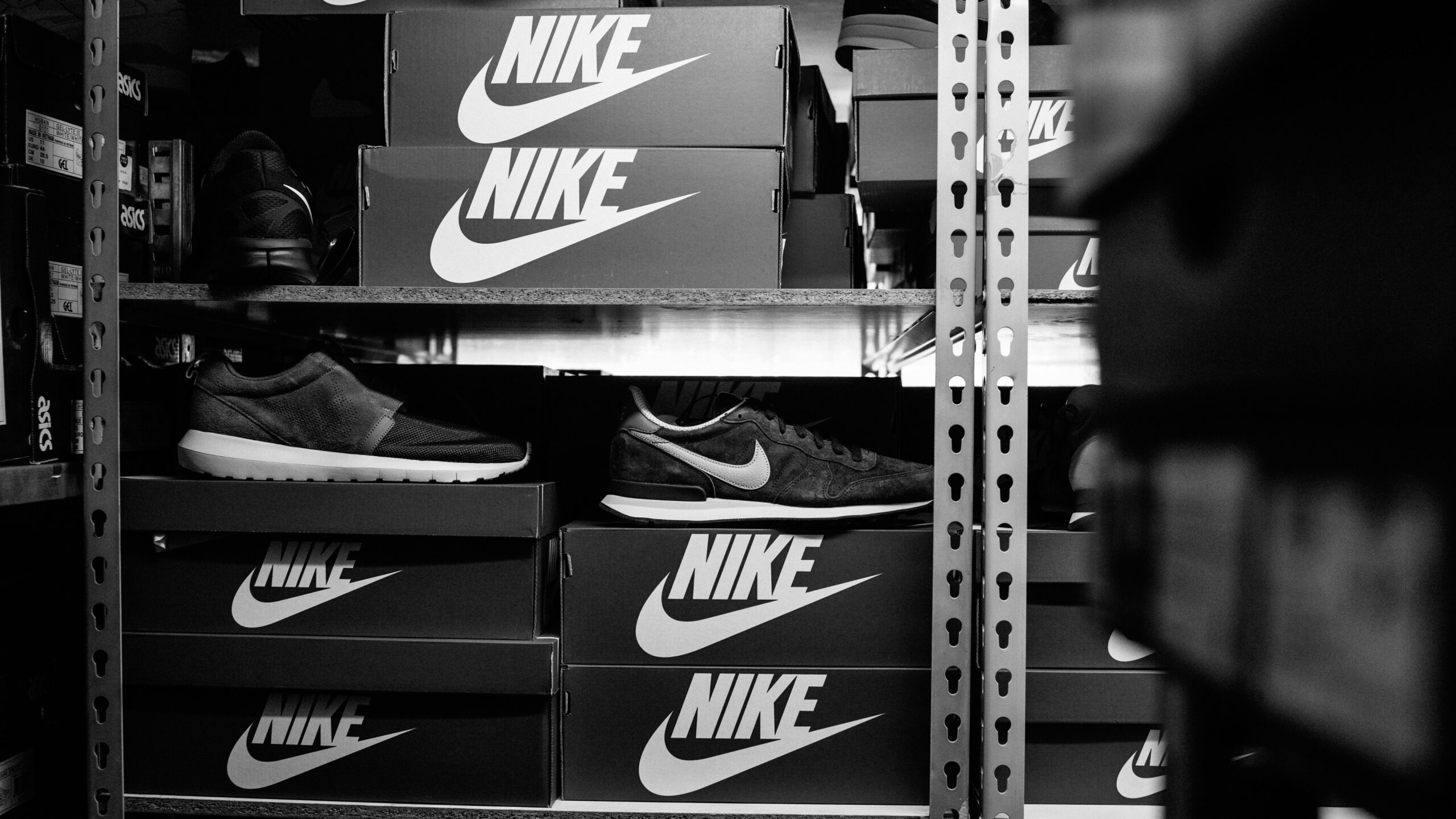 a black and white photo of a pair of nike shoes