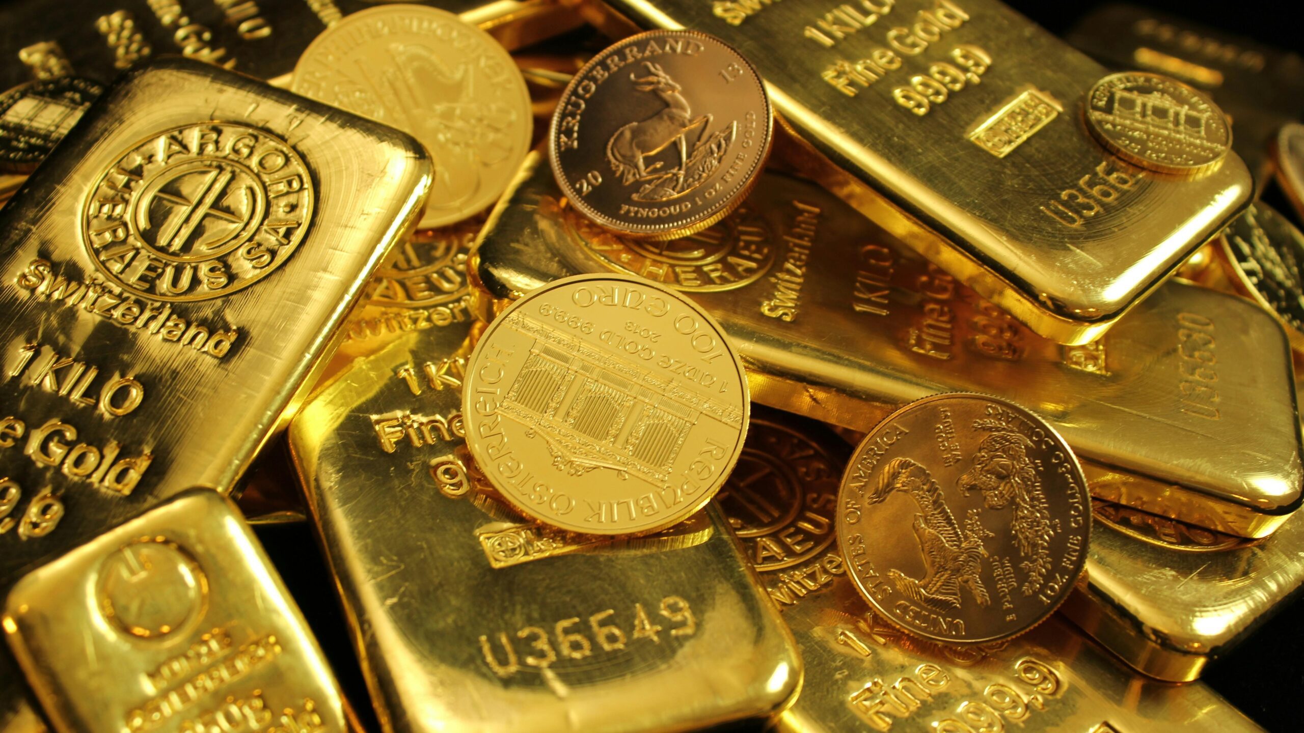 Detailed close-up of gold bars and coins, symbolizing wealth and investment. Perfect for financial imagery.