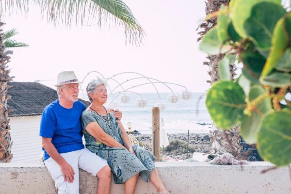 Happy senior couple hug with love and enjoy together outdoor leisure activity