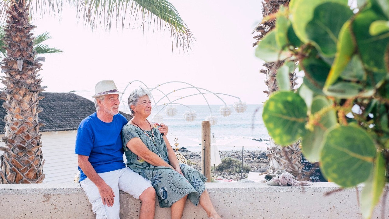 Happy senior couple hug with love and enjoy together outdoor leisure activity