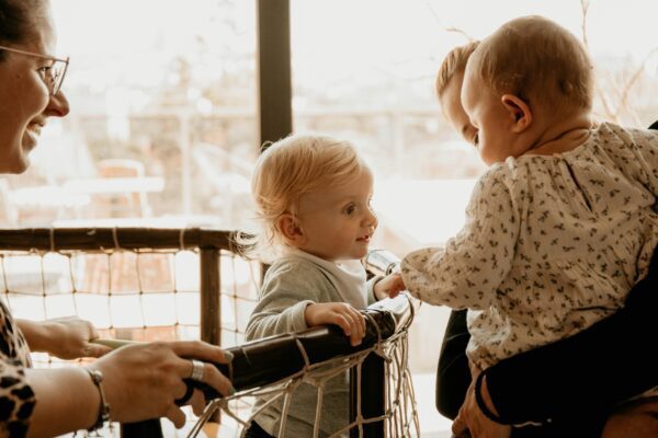 a woman and a child looking at a book