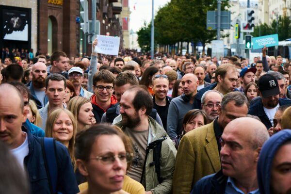 people gathering near brown building during daytime