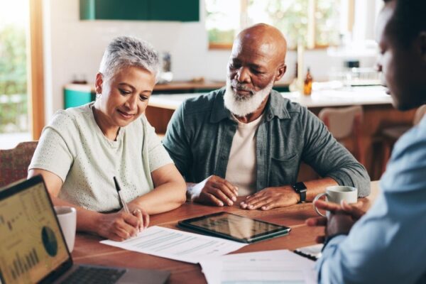 Signature documents and old couple with financial advisor for retirement fund fraud protection and pension planning Trust agreement policy and offer with people at home for account manager