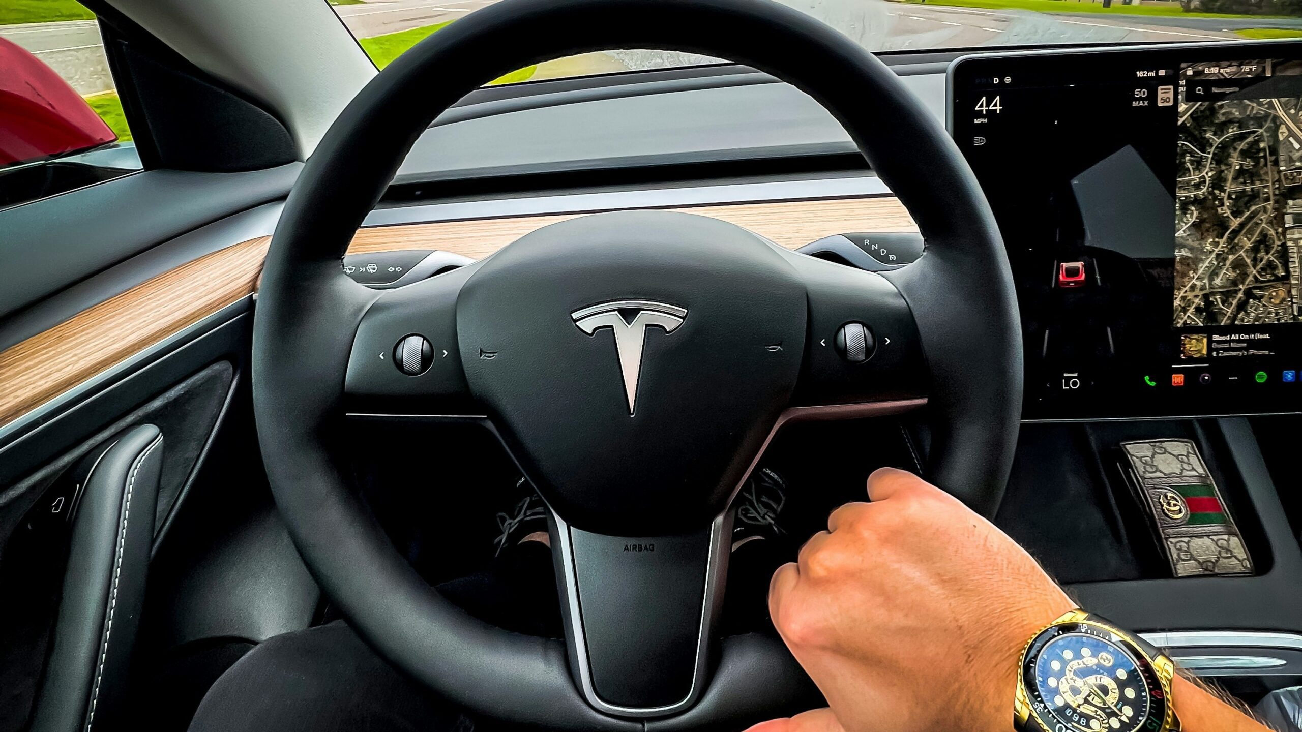 a man driving a car on a highway