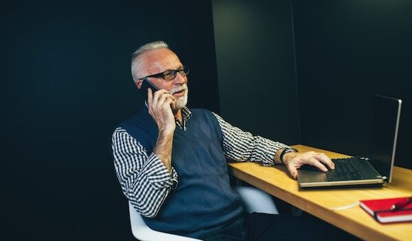 Senior man working in his office.