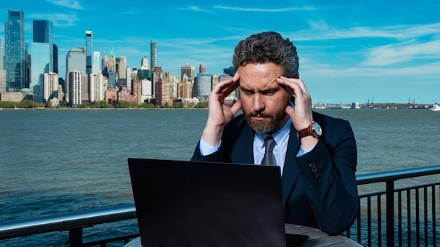 Business man using laptop outdoor in new york city business american success american business dream
