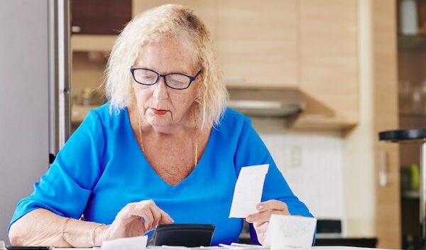 Senior woman handles bookkeeping