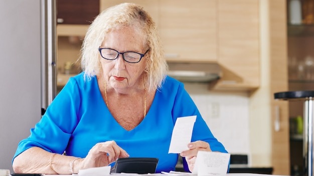 Senior woman handles bookkeeping