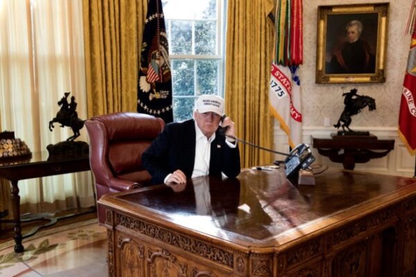 President Donald Trump is seen “working” in this photo released by the White House on Jan. 20, 2018