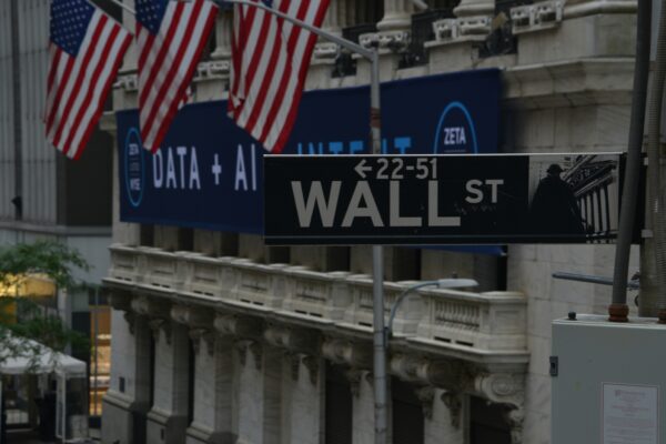a street sign on wall street in new york city
