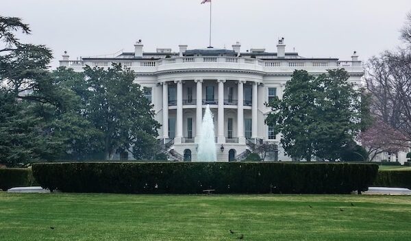 White house lawn and fountain in Washington, DC with gray sky
