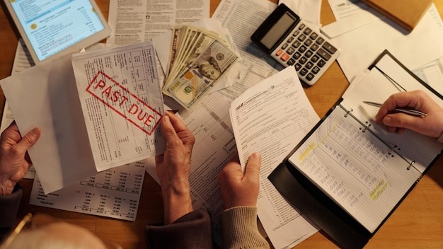 Hands of seniors working with documents