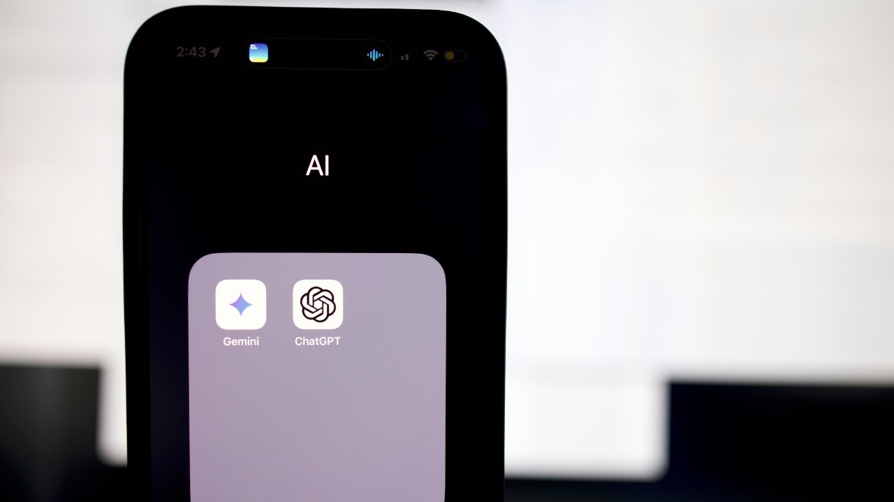 a close up of a cell phone with an ai button