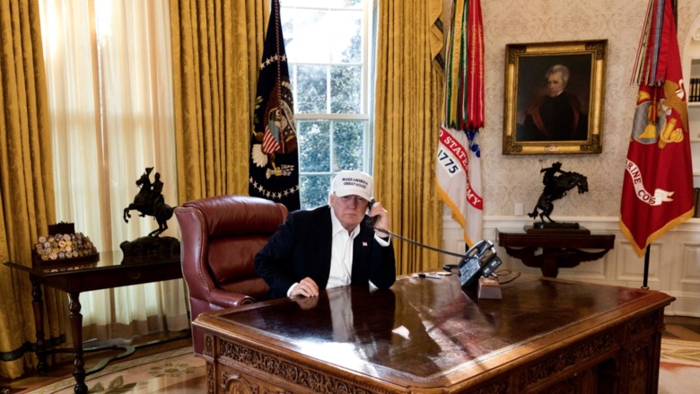 President Donald Trump is seen “working” in this photo released by the White House on Jan. 20, 2018