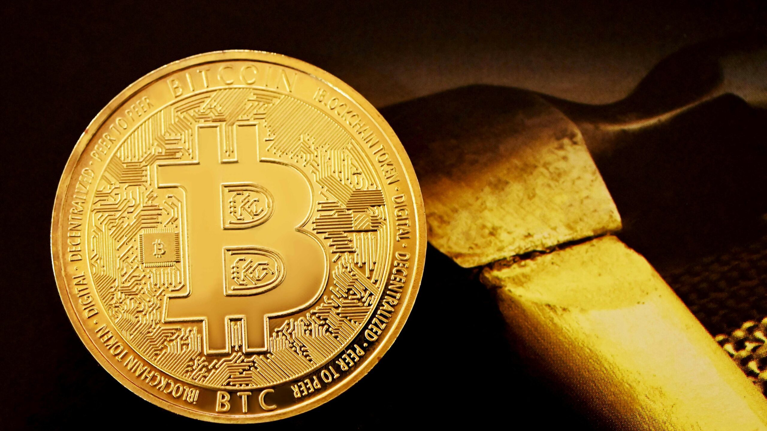 gold round coin on black surface