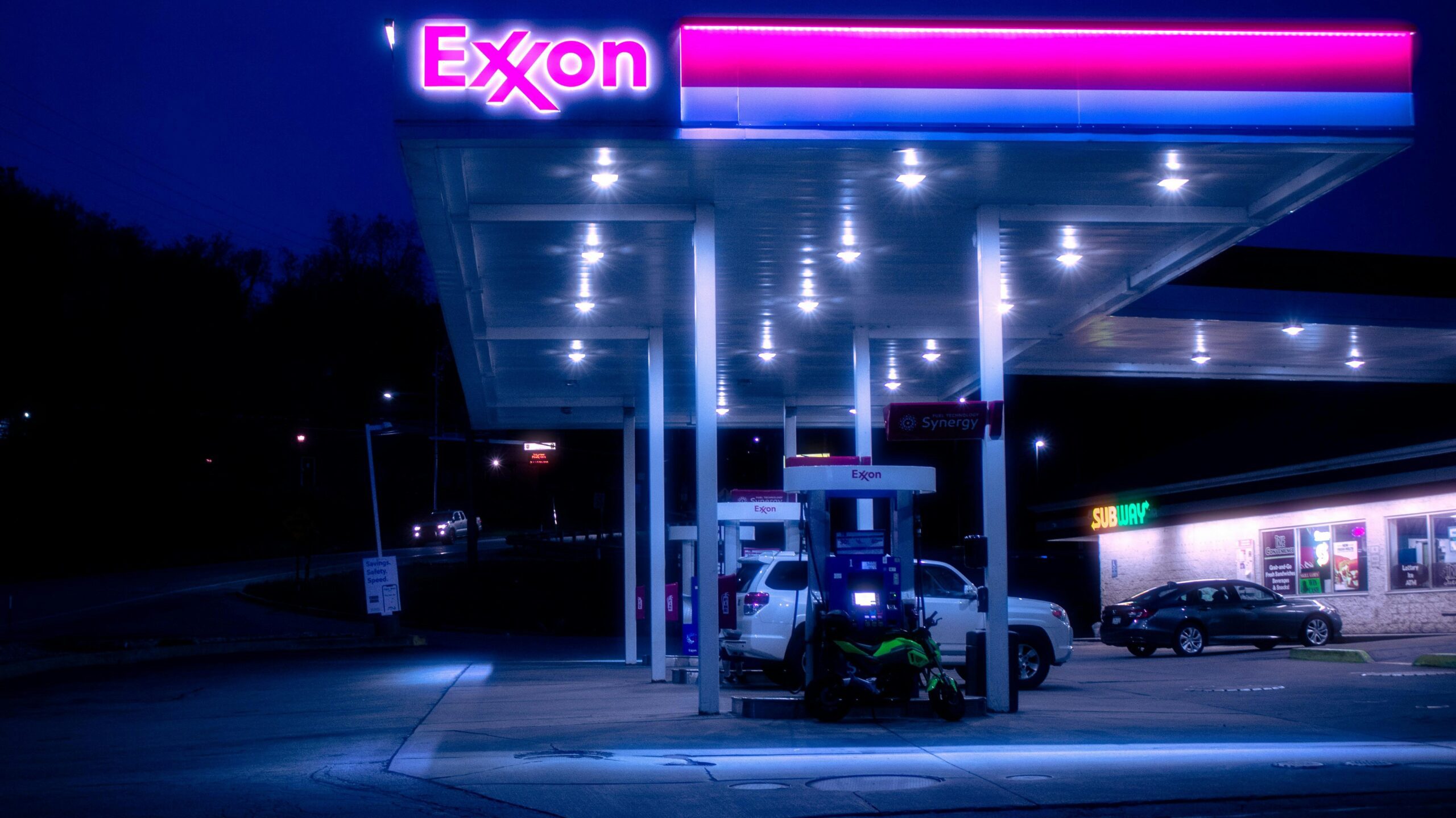 cars parked in front of UNKs store during night time