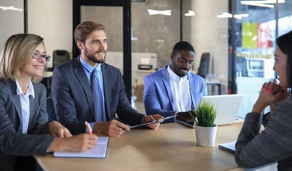 Job interview with the employer, businessman listen to candidate answers.