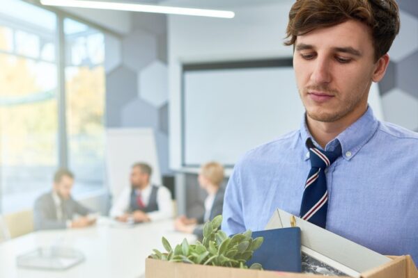 Sad Young Man leaving Job