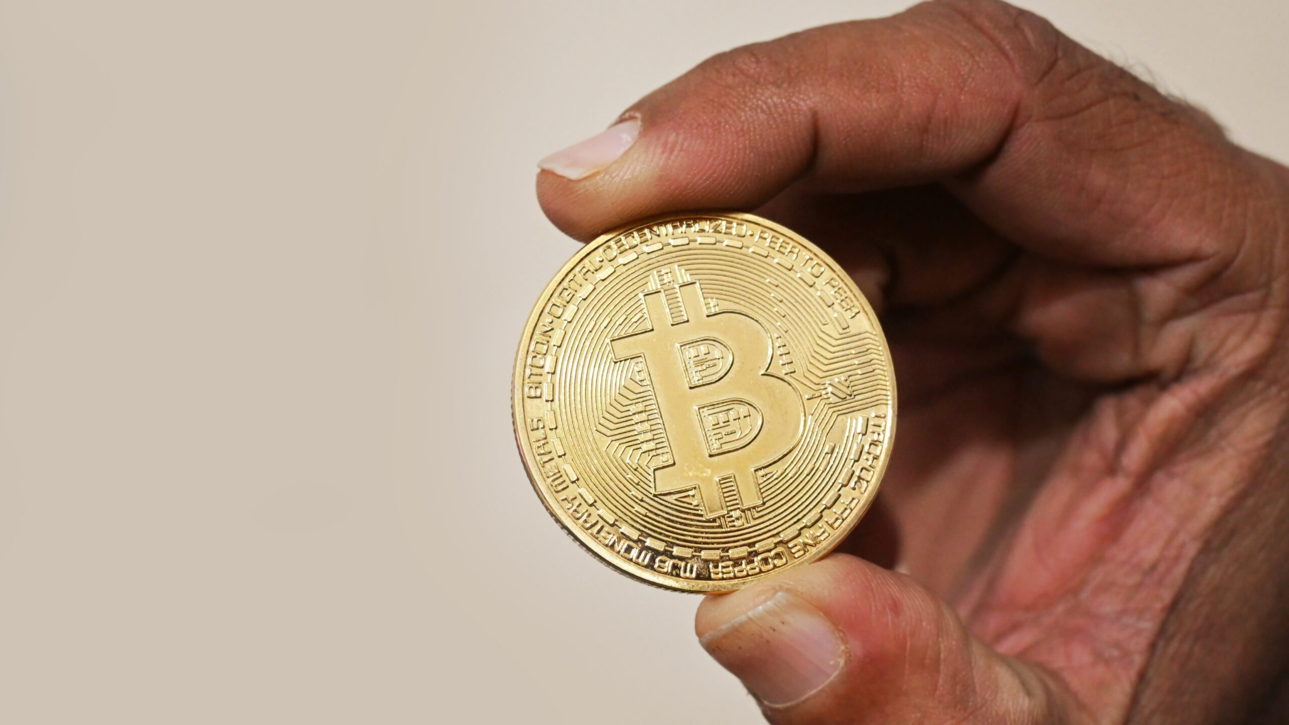 Holding Bitcoin cryptocurrency coin