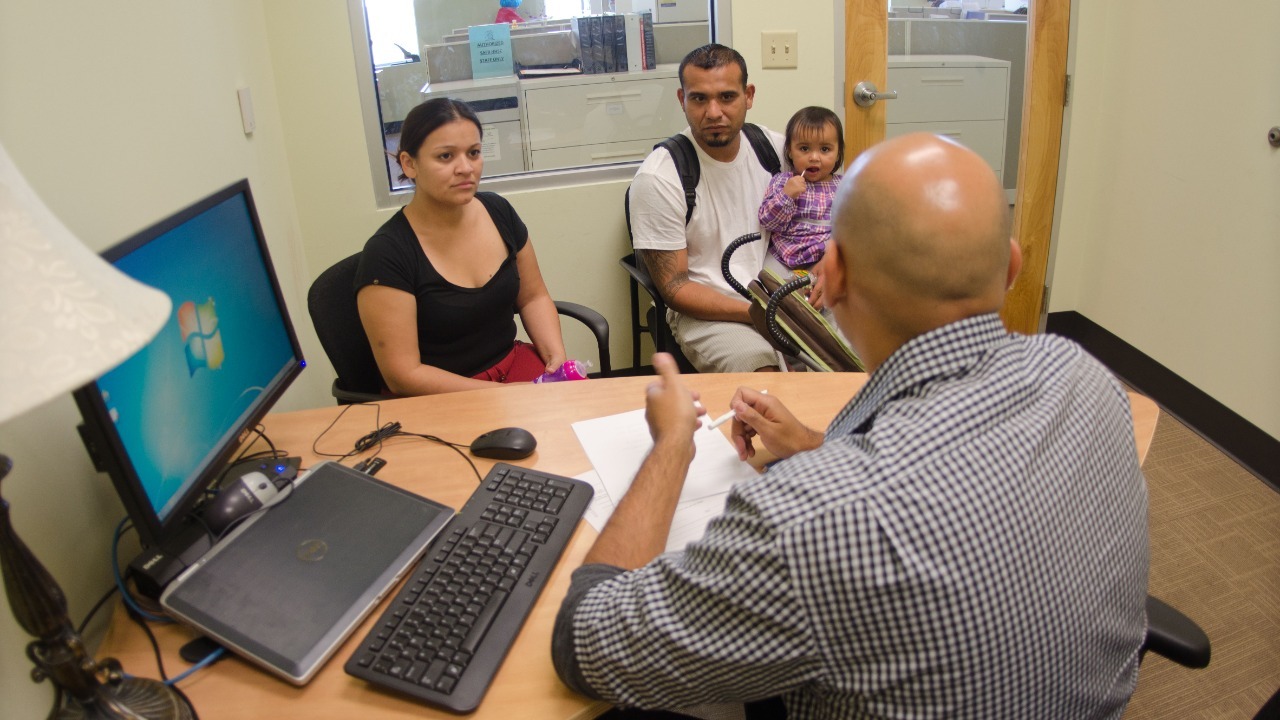 San Antonio Food Bank providing information and the SNAP application to help the family with their needs