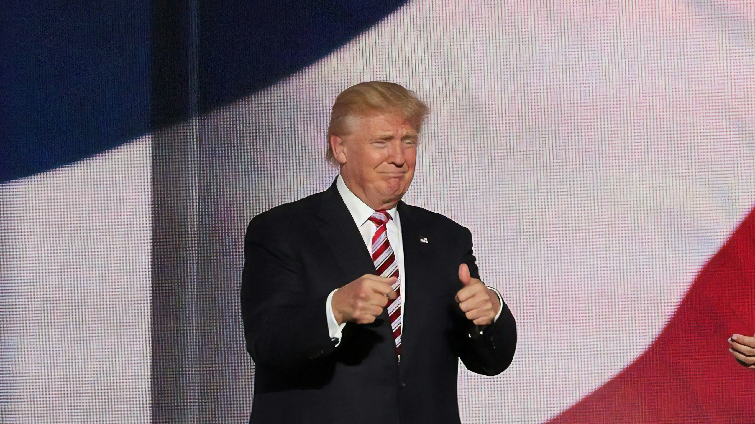 Donald Trump beside man in black suit