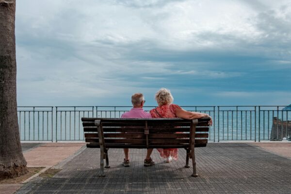 Couple enjoys a view of the water.
