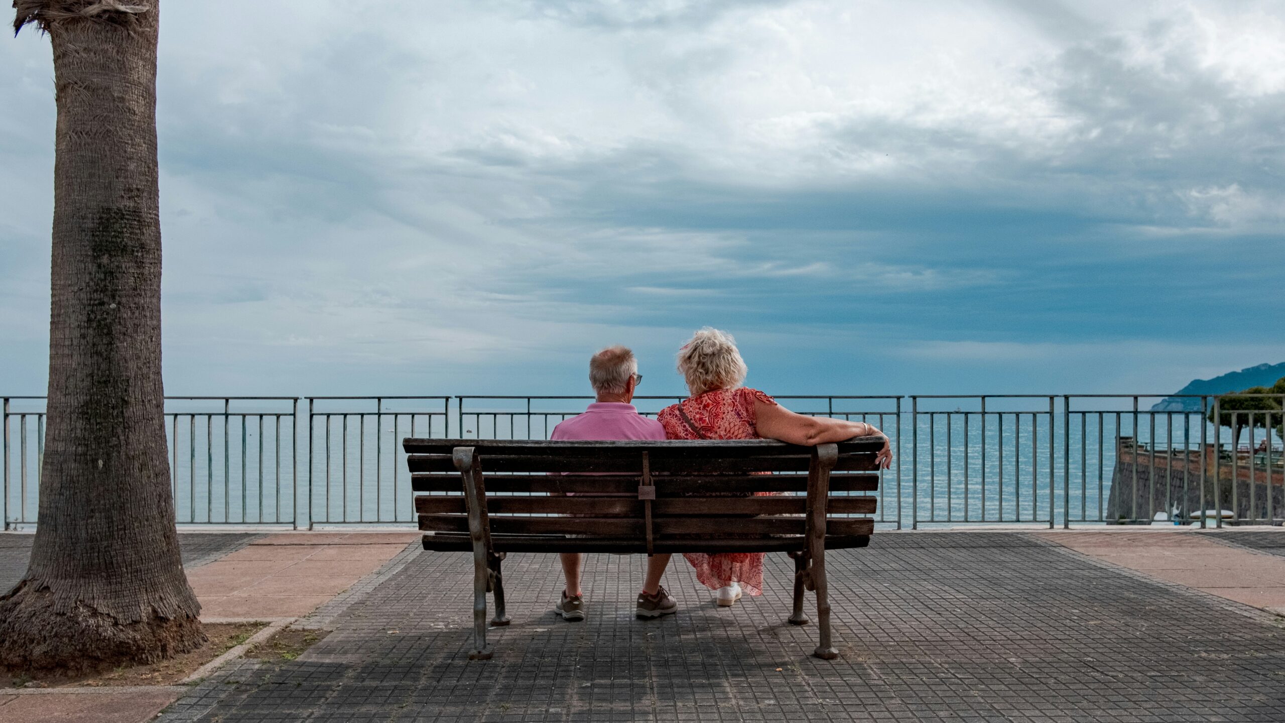 Couple enjoys a view of the water.