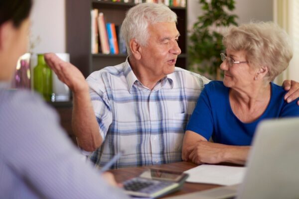 Senior couple making a financial deal